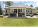 Spacious backyard patio with a built-in bar area, comfortable seating, and lush landscaping at 3612 Griffice Mill Rd, Raleigh, NC 27610