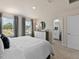 Bright and airy main bedroom with large windows, and an ensuite bathroom at 3710 Rosebush Dr, Zebulon, NC 27597