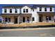 New construction townhomes featuring modern architecture and quality Tyvek HomeWrap for energy efficiency at 3712 Rosebush Dr, Zebulon, NC 27597