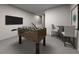 Fun game room with foosball table, entertainment area, and neutral decor for versatile use at 3712 Rosebush Dr, Zebulon, NC 27597