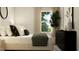 Bright bedroom featuring white walls, hardwood floors, and a natural decor at 4017 Shadbush St, Raleigh, NC 27616