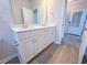 Bright bathroom features a double sink vanity with white cabinets and modern fixtures at 428 Duncan Creek Rd # 157, Lillington, NC 27546