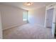 Cozy bedroom featuring neutral walls, soft carpet, and a window offering a serene view at 428 Duncan Creek Rd # 157, Lillington, NC 27546