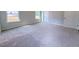Brightly lit bedroom with neutral colored walls, carpet, and trim at 428 Duncan Creek Rd # 157, Lillington, NC 27546