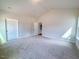 Large, bright bedroom with neutral carpet and paint at 428 Duncan Creek Rd # 157, Lillington, NC 27546