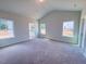 Spacious main bedroom with three large windows and ensuite bathroom at 428 Duncan Creek Rd # 157, Lillington, NC 27546