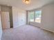 Large bedroom features a large window with natural light and a double closet at 428 Duncan Creek Rd # 157, Lillington, NC 27546