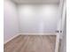 Empty bedroom with plank flooring and neutral walls provides a serene space at 428 Duncan Creek Rd # 157, Lillington, NC 27546