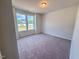 Bright bedroom featuring a large window at 428 Duncan Creek Rd # 157, Lillington, NC 27546