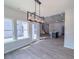 Bright dining area features modern lighting and an adjacent kitchen with an island at 428 Duncan Creek Rd # 157, Lillington, NC 27546