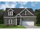 Charming brick home with a two-car garage and a well-manicured front lawn at 428 Duncan Creek Rd # 157, Lillington, NC 27546