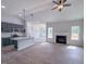 Spacious living room featuring an open kitchen, fireplace, and stylish ceiling fan at 428 Duncan Creek Rd # 157, Lillington, NC 27546