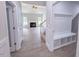 Open-concept living area with fireplace, ceiling fan, and stairs in background at 428 Duncan Creek Rd # 157, Lillington, NC 27546