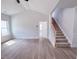 Bright, open living room with staircase and hardwood floors at 428 Duncan Creek Rd # 157, Lillington, NC 27546