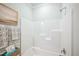 Clean bathroom with a white shower and tub combination at 4304 Hunters Brook Run, Raleigh, NC 27616
