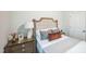 Cozy bedroom featuring a decorative headboard and natural light at 4304 Hunters Brook Run, Raleigh, NC 27616