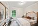 Comfortable bedroom with a large window and neutral color palette at 4304 Hunters Brook Run, Raleigh, NC 27616