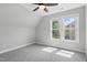 Neutral bedroom features a ceiling fan and a double window providing plenty of natural light at 4418 Gallatree Ln, Raleigh, NC 27616