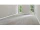 Cozy bedroom with soft carpet and natural light from two windows at 4418 Gallatree Ln, Raleigh, NC 27616