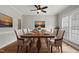 Elegant dining room featuring a wooden table, upholstered chairs, and natural lighting at 4418 Gallatree Ln, Raleigh, NC 27616