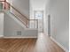Bright entryway with high ceilings, wood floors, staircase, and a large arched window at 4418 Gallatree Ln, Raleigh, NC 27616