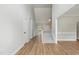 Bright foyer with hardwood floors, a staircase, and a high ceiling, creating an open and welcoming entrance at 4418 Gallatree Ln, Raleigh, NC 27616