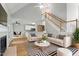 Cozy living room with fireplace, stylish seating, and open floor plan at 4418 Gallatree Ln, Raleigh, NC 27616