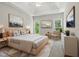 Beautiful main bedroom with tray ceiling, carpet, and natural light from windows at 4418 Gallatree Ln, Raleigh, NC 27616