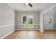 Bright room featuring wood floors, white trim, and natural light from the windows at 4418 Gallatree Ln, Raleigh, NC 27616
