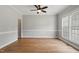 Bright room with wood floors, neutral walls, and ample natural light from large windows at 4418 Gallatree Ln, Raleigh, NC 27616
