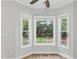 Bright window nook with multiple windows and ceiling fan at 4418 Gallatree Ln, Raleigh, NC 27616