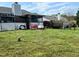 Large backyard featuring a covered patio, swing set, and fenced in area at 501 Bellmeade Bay Dr, Durham, NC 27703