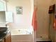 Bathroom with a soaker tub, glass enclosed shower and updated fixtures at 501 Bellmeade Bay Dr, Durham, NC 27703