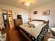 Cozy bedroom with natural light, wood-look flooring, and door to hallway at 501 Bellmeade Bay Dr, Durham, NC 27703