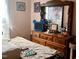 Cozy bedroom with dresser and a beautiful antique mirror at 501 Bellmeade Bay Dr, Durham, NC 27703
