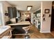 Well-lit kitchen with granite countertops, stainless steel appliances, and dark cabinetry at 501 Bellmeade Bay Dr, Durham, NC 27703