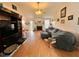Spacious living room with vaulted ceiling, fireplace, wood floors, and natural light at 501 Bellmeade Bay Dr, Durham, NC 27703