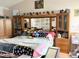 Main bedroom with a mirrored headboard, a platform for pets, and natural light at 501 Bellmeade Bay Dr, Durham, NC 27703
