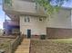 Home exterior with a wooden staircase leading to a partially covered deck at 517 Hidden Cellars Dr, Holly Springs, NC 27540