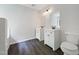 Spacious bathroom with double vanities and modern fixtures at 517 Hidden Cellars Dr, Holly Springs, NC 27540