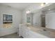 Bathroom features a double sink vanity, large mirror, and natural light from a window at 545 Beacon Hill Rd # 32, Lillington, NC 27546