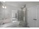 Bathroom featuring double sinks, a glass shower, and linen closet access at 545 Beacon Hill Rd # 32, Lillington, NC 27546