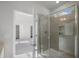 Glass shower enclosure with tile surround; bathroom includes linen closet and access to bedroom at 545 Beacon Hill Rd # 32, Lillington, NC 27546