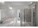 Bathroom featuring double sinks, a glass shower, and access to bedroom at 545 Beacon Hill Rd # 32, Lillington, NC 27546