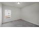 Bright bedroom showcasing neutral carpeting, a light fixture, and a window for natural light at 545 Beacon Hill Rd # 32, Lillington, NC 27546
