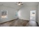 Bright bedroom with wood floors and multiple windows for natural light and views at 545 Beacon Hill Rd # 32, Lillington, NC 27546