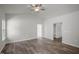 Spacious bedroom featuring vaulted ceilings, wood floors, and ample natural light from a large window at 545 Beacon Hill Rd # 32, Lillington, NC 27546