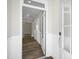 Bright and airy entryway with wood flooring, white trim, and views into the home at 545 Beacon Hill Rd # 32, Lillington, NC 27546