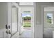 Beautiful entryway showcasing wood floors and a view of the lawn from the front door at 545 Beacon Hill Rd # 32, Lillington, NC 27546