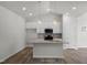 Contemporary kitchen featuring an island with a stone countertop and stainless steel appliances at 545 Beacon Hill Rd # 32, Lillington, NC 27546